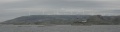 <center>Buholmråsa med Oksbåsheia i bakgrunnen - sett fra Hurtigruta